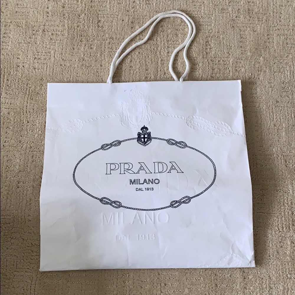 Prada white shopping bag.